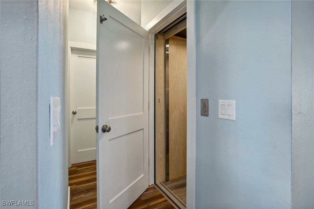 8335 Main Street Bokeelia, FL 33922 - Photo 27 of 47 a bathroom with a shower and a door