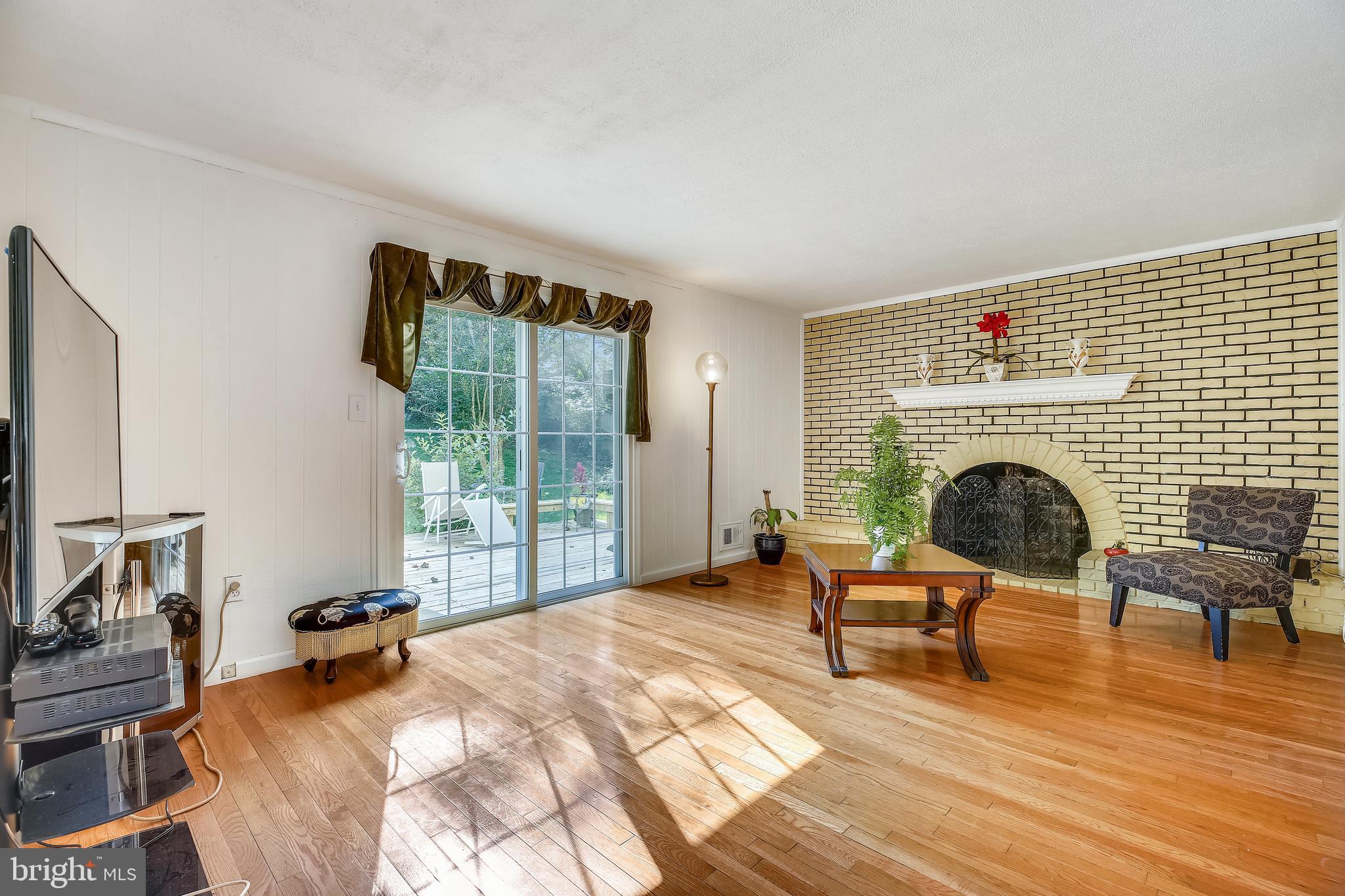 13605 Wagon Way Silver Spring, MD 20906 - Photo 14 of 41 Family Room with Arched Brick Fireplace
