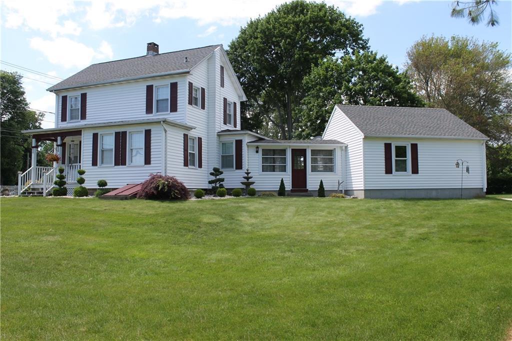 112 Shore Road Old Lyme, CT 06371 - Photo 1 of 1 a front view of a house with garden