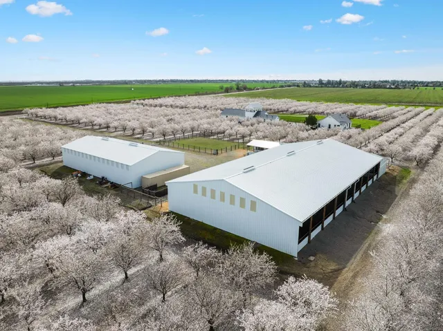 a front view of a house with porch and outdoor seating