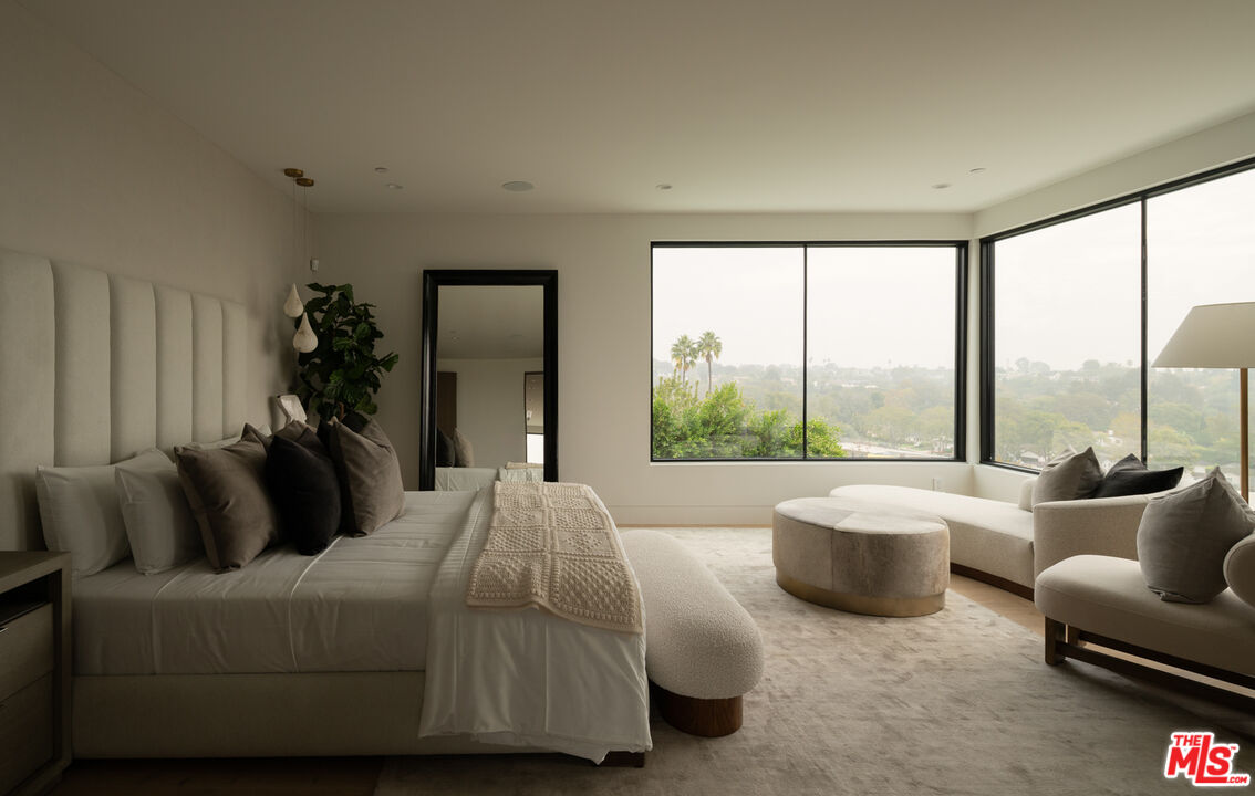 9919 Girla Way Los Angeles, CA 90064 - Photo 13 of 31 a bed room with couch and a window