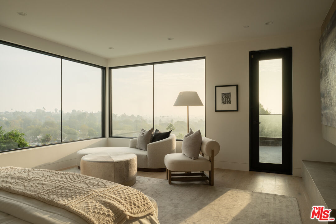 9919 Girla Way Los Angeles, CA 90064 - Photo 14 of 31 a bedroom with furniture and a large window
