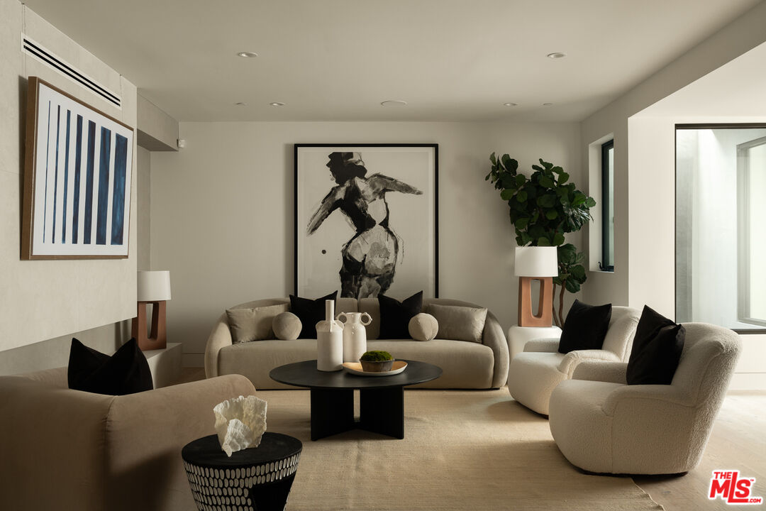 9919 Girla Way Los Angeles, CA 90064 - Photo 26 of 31 a living room with furniture potted plant and a window