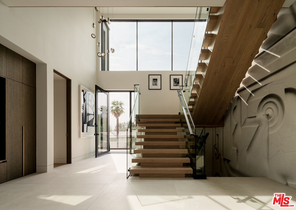 9919 Girla Way Los Angeles, CA 90064 - Photo 3 of 31 a view of an entryway with staircase