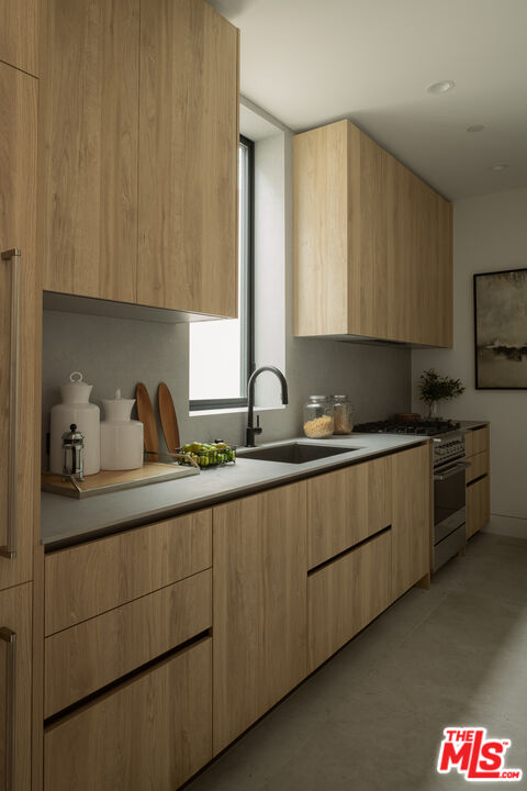 9919 Girla Way Los Angeles, CA 90064 - Photo 7 of 31 a kitchen with sink and cabinets