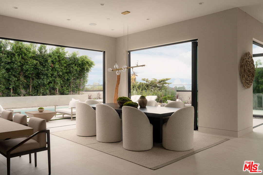 9919 Girla Way Los Angeles, CA 90064 - Photo 8 of 31 a living room with large window and furniture