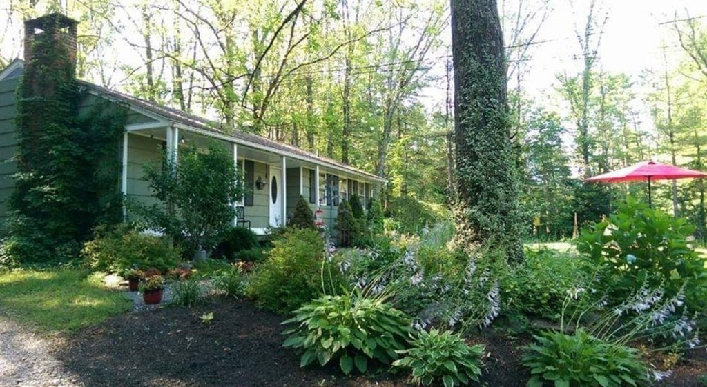 74 Walker Pond Road Sturbridge, MA 01566 - Photo 21 of 42 a house view with a garden space
