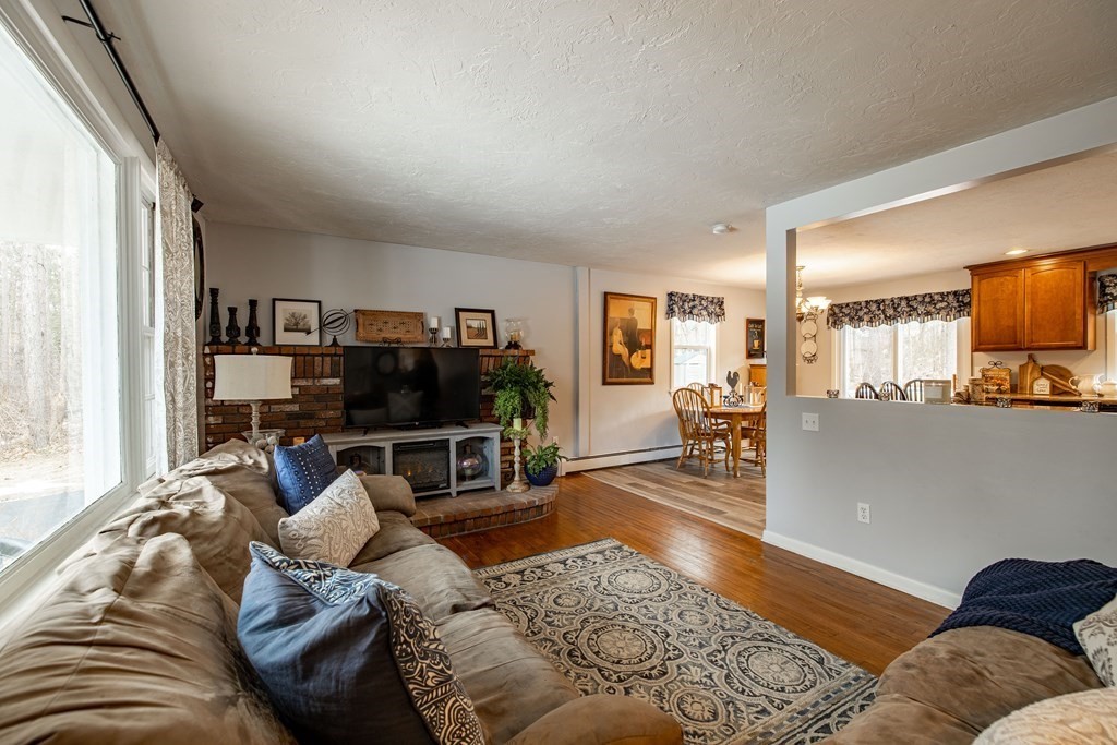 74 Walker Pond Road Sturbridge, MA 01566 - Photo 8 of 42 a living room with furniture and a flat screen tv