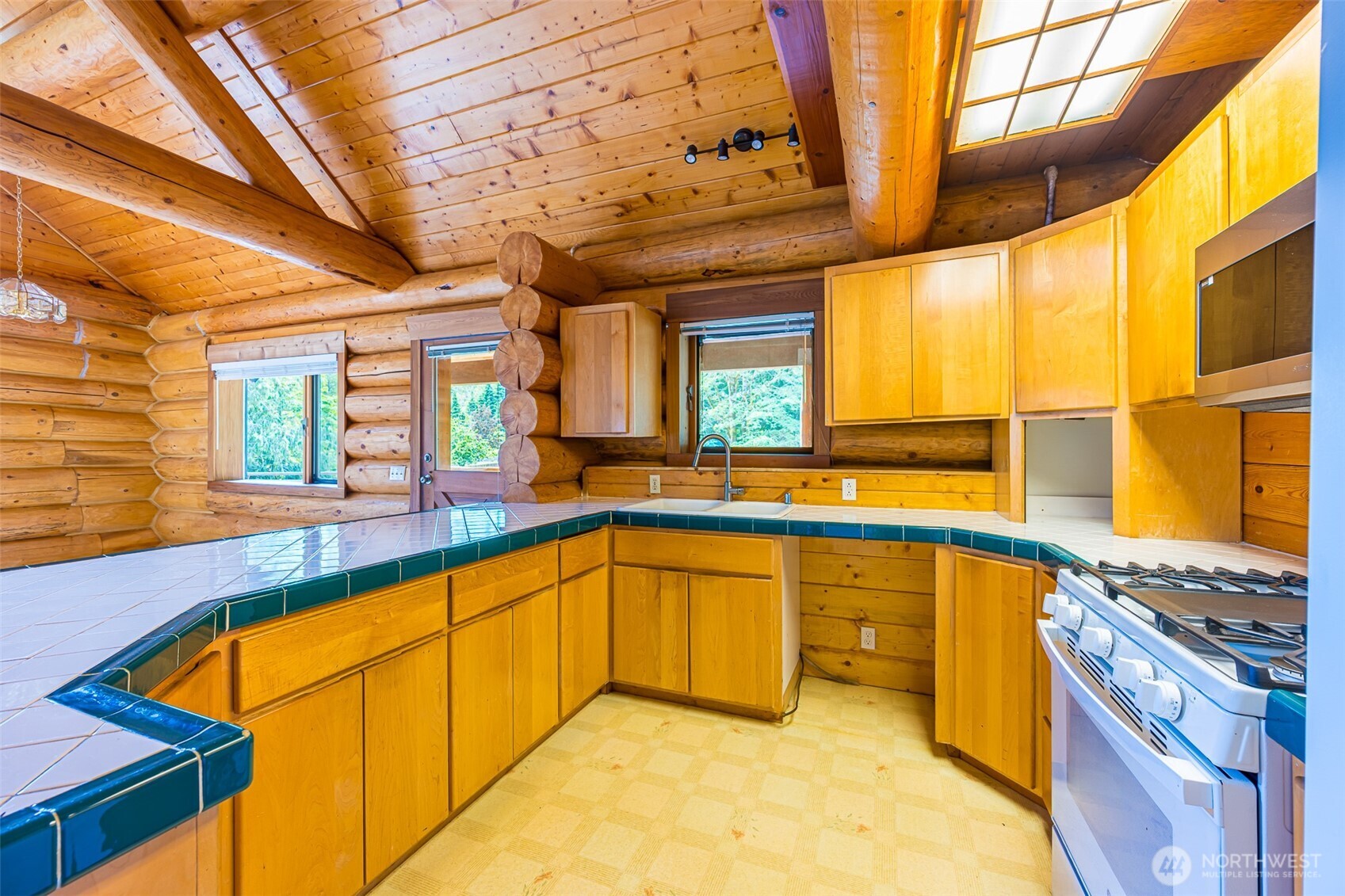 1422 Grauel-Ramapo Road Port Angeles, WA 98363 - Photo 9 of 40 a view of a kitchen with a sink and cabinets