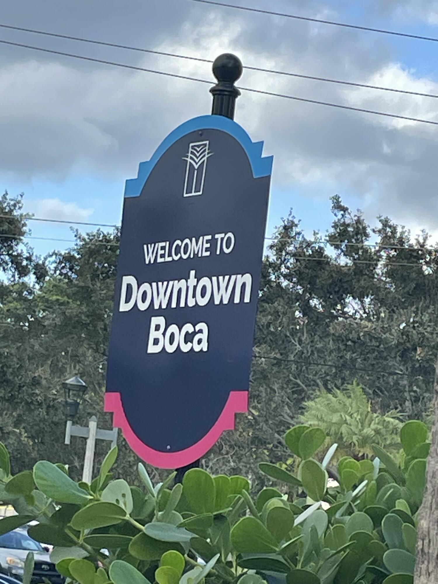 55 Southwest 2nd Avenue, Unit 2030 Boca Raton, FL 33432 - Photo 3 of 14 a view of a sign under a tree