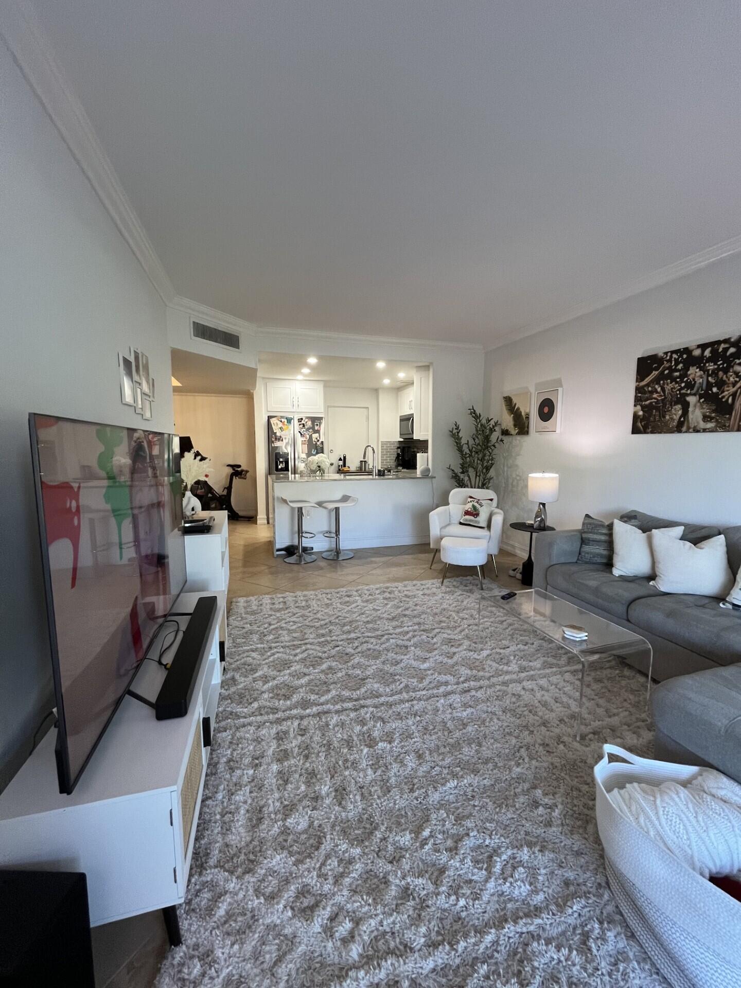 55 Southwest 2nd Avenue, Unit 2030 Boca Raton, FL 33432 - Photo 6 of 14 a living room with furniture and a couch