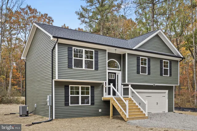 a front view of a house with garage