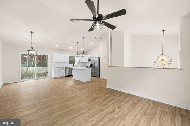 a view of a kitchen with microwave and stove
