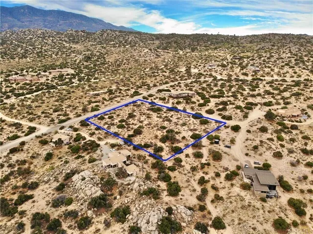 an aerial view of house with yard