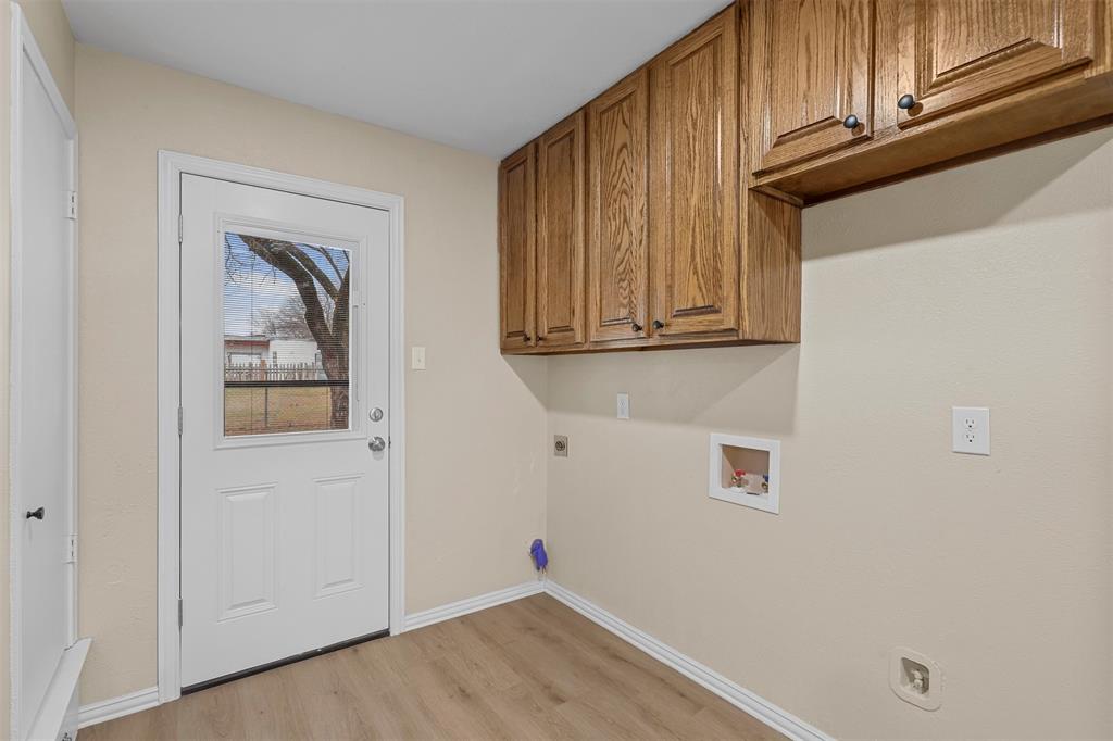 2801 Skyline Drive, Unit A Sansom Park, TX 76114 - Photo 8 of 16 a view of a storage and utility room with wooden floor