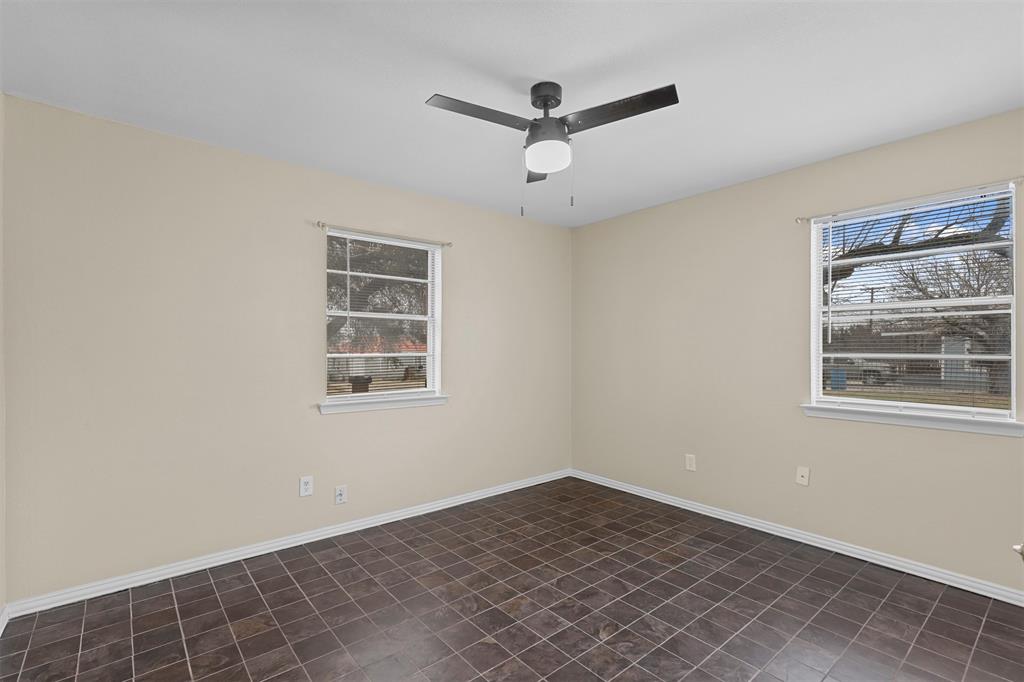 2801 Skyline Drive, Unit A Sansom Park, TX 76114 - Photo 9 of 16 a view of a livingroom with a ceiling fan and window