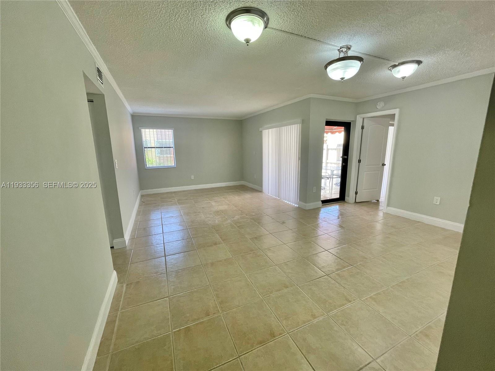 10897 Northwest 7th Street, Unit 1429 Miami, FL 33172 - Photo 4 of 17 a view of an empty room and window