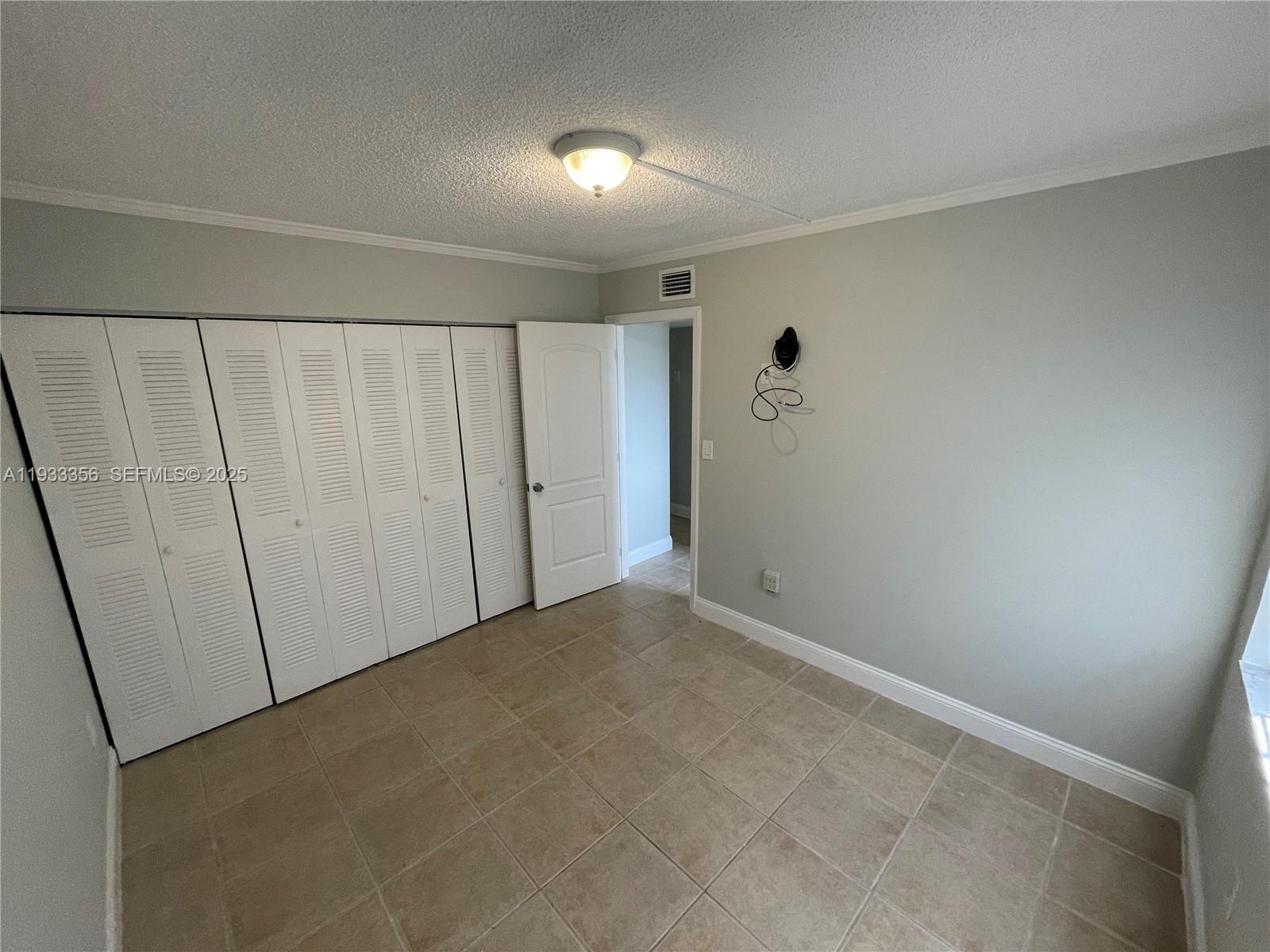 10897 Northwest 7th Street, Unit 1429 Miami, FL 33172 - Photo 9 of 17 a view of an empty room