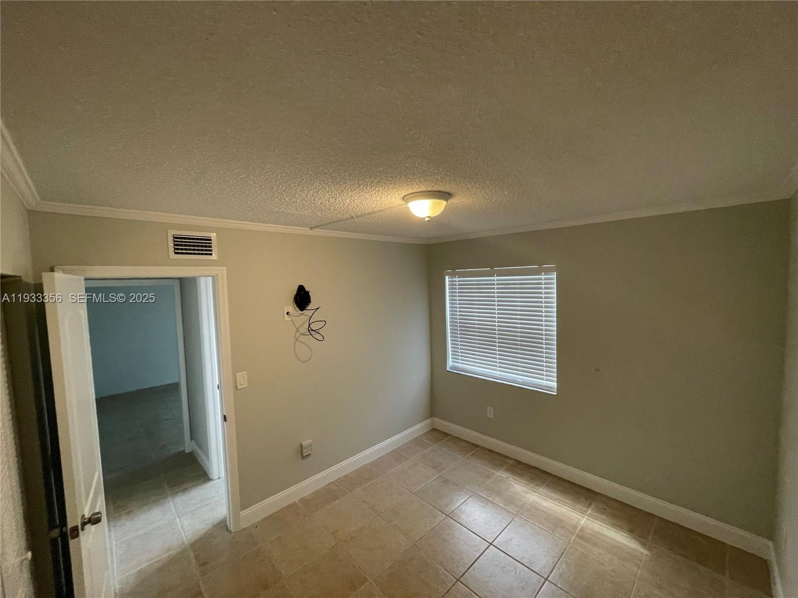 10897 Northwest 7th Street, Unit 1429 Miami, FL 33172 - Photo 10 of 17 an empty room with windows and closet