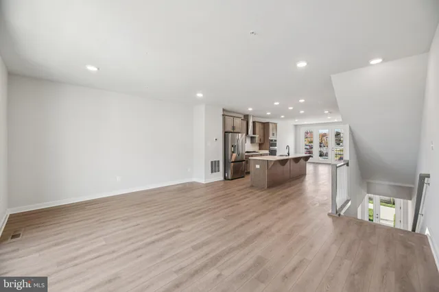 a view of kitchen and kitchen with a sink