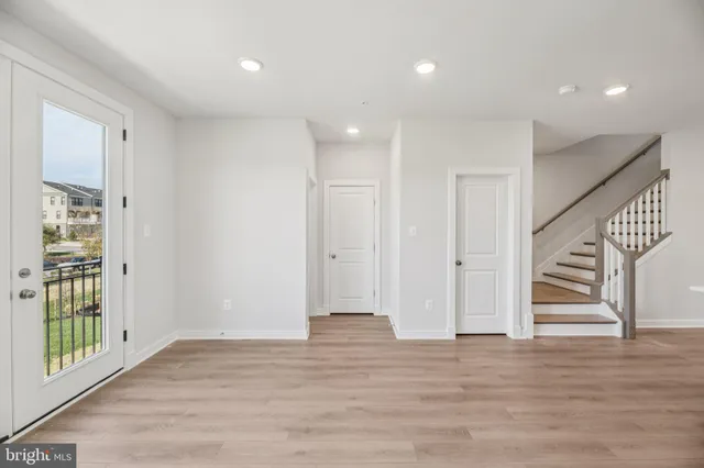 a view of entryway with wooden floor