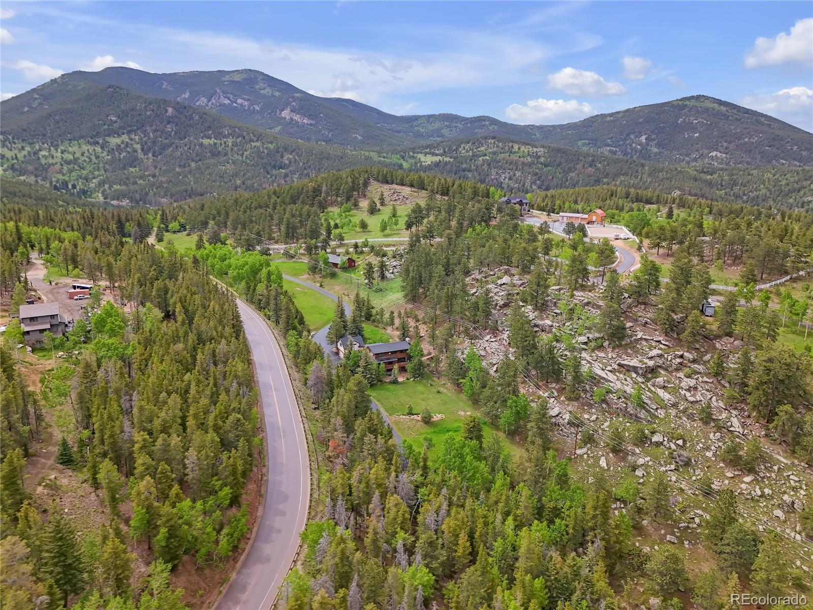 24 Pine Valley Road Evergreen, CO 80439 - Photo 44 of 50 a view of a city with mountains in the background