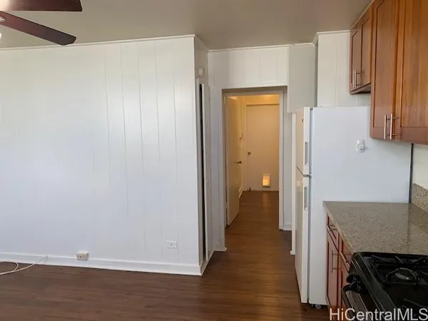 a view of a kitchen from the hallway