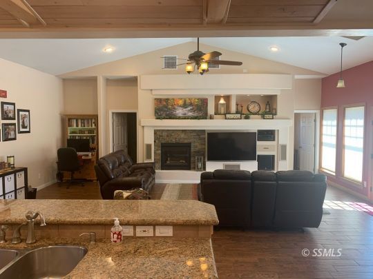 600 South Erin Street Ridgecrest, CA 93555 - Photo 17 of 39 a living room with furniture and a fireplace