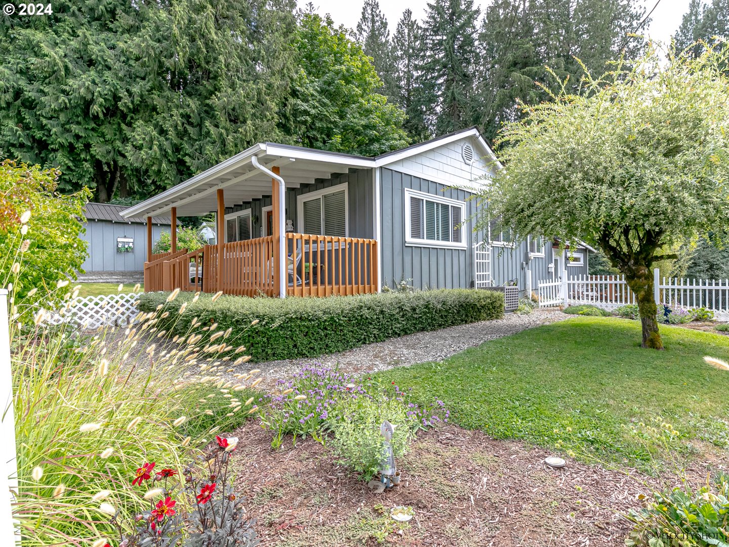 40170 Southeast Fish Hatchery Road Sandy, OR 97055 - Photo 1 of 30 a front view of a house with a garden