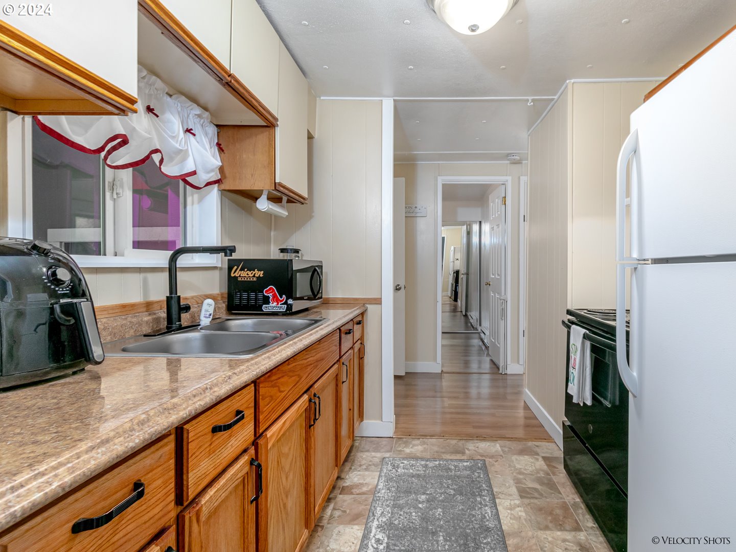 40170 Southeast Fish Hatchery Road Sandy, OR 97055 - Photo 20 of 30 a kitchen with stainless steel appliances granite countertop a sink and cabinets