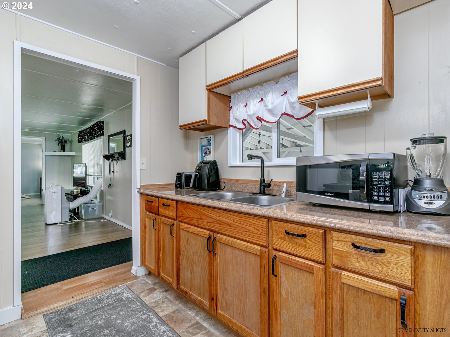 40170 Southeast Fish Hatchery Road Sandy, OR 97055 - Photo 21 of 30 a kitchen with stainless steel appliances granite countertop a sink and cabinets