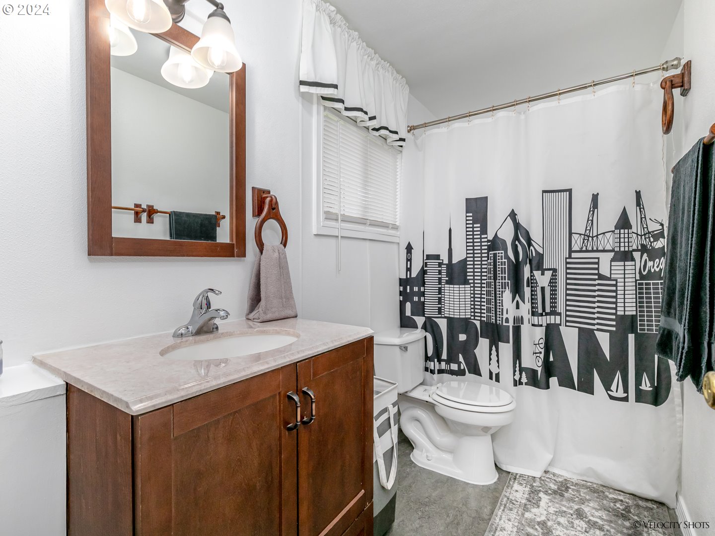40170 Southeast Fish Hatchery Road Sandy, OR 97055 - Photo 25 of 30 a bathroom with a sink a toilet a mirror and shower