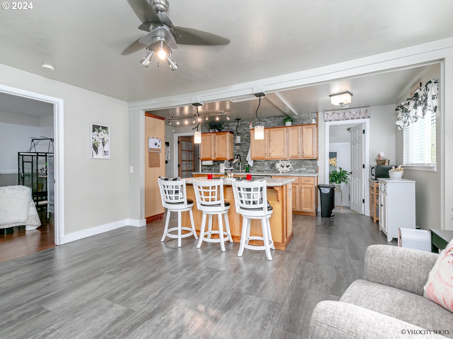 40170 Southeast Fish Hatchery Road Sandy, OR 97055 - Photo 3 of 30 a dining room with stainless steel appliances kitchen island granite countertop a dining table chairs and view living room