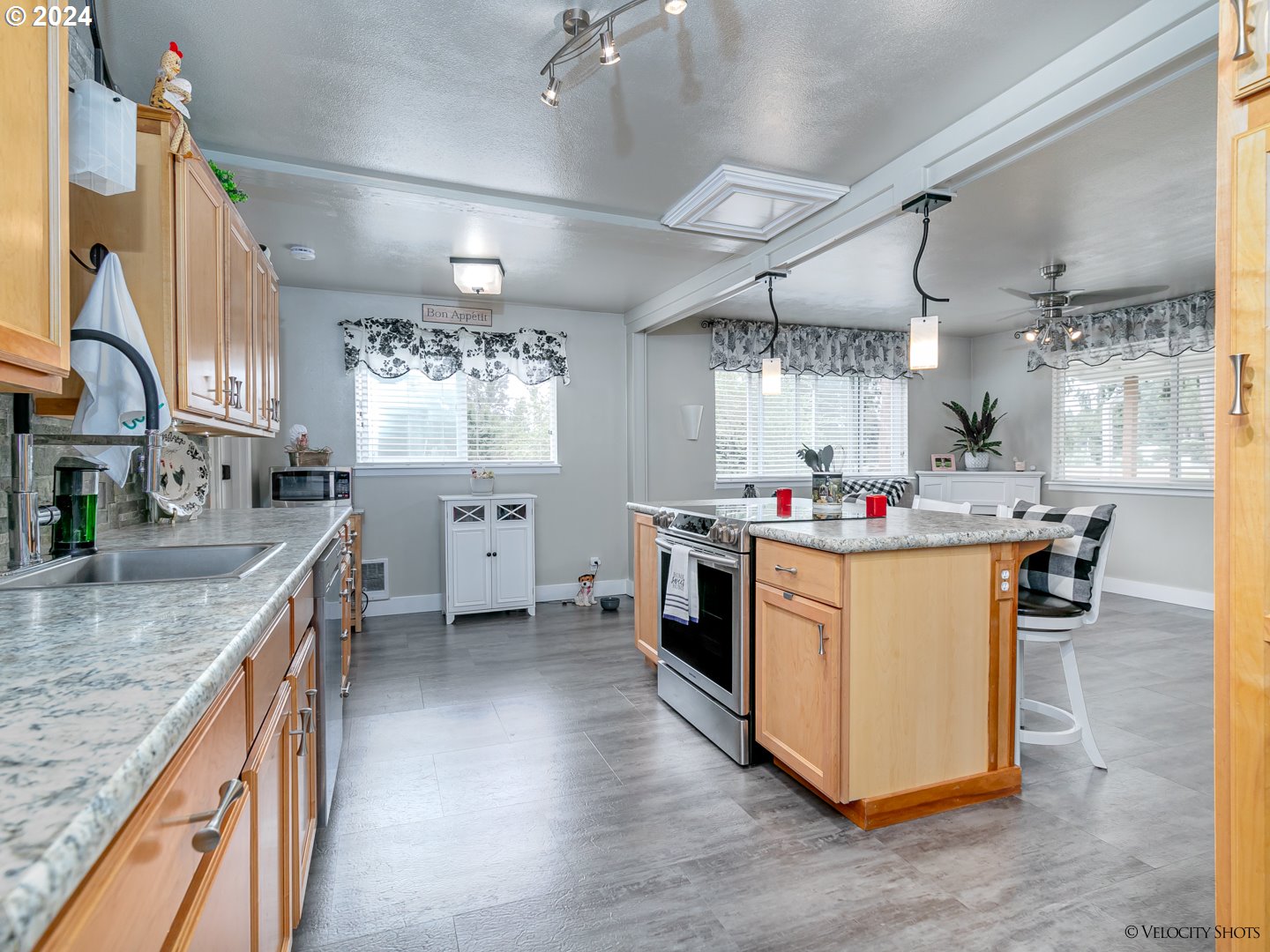40170 Southeast Fish Hatchery Road Sandy, OR 97055 - Photo 4 of 30 a kitchen with stainless steel appliances granite countertop a sink a stove and a wooden floors