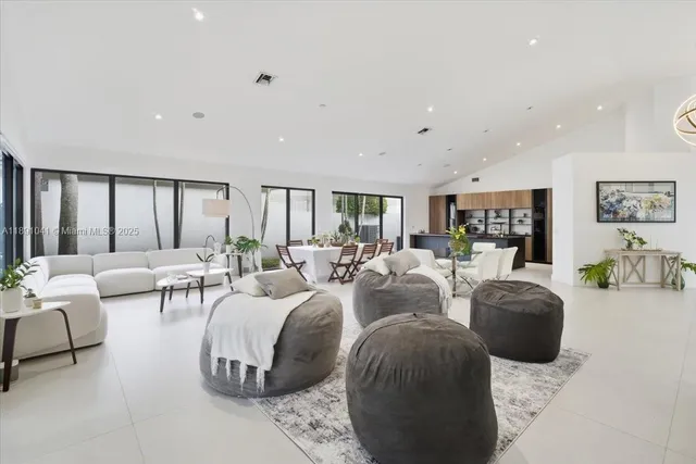 a kitchen with stainless steel appliances a sink and cabinets