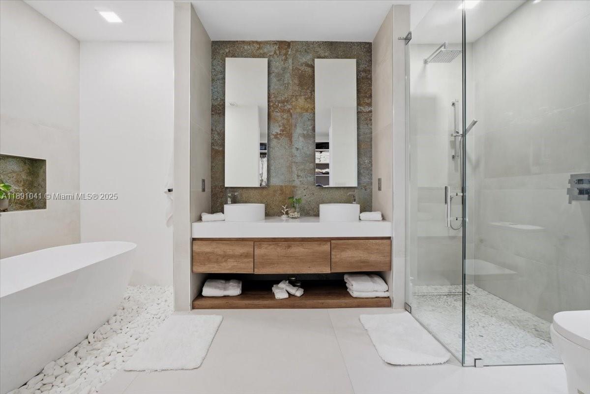 1441 154th Avenue Pembroke Pines, FL 33027 - Photo 22 of 37 a bathroom with a sink a toilet and shower