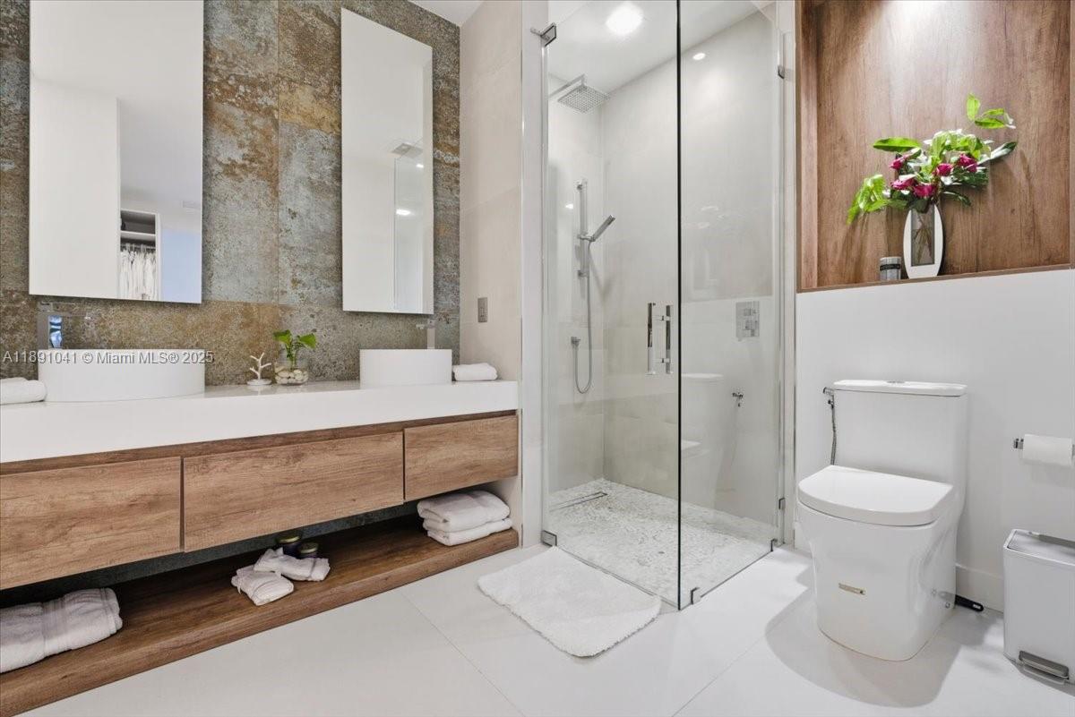 1441 154th Avenue Pembroke Pines, FL 33027 - Photo 23 of 37 a spacious bathroom with a granite countertop sink a toilet and shower