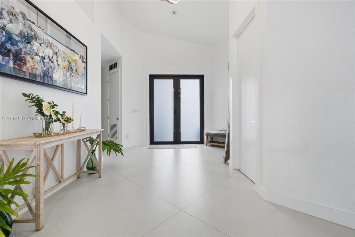 1441 154th Avenue Pembroke Pines, FL 33027 - Photo 25 of 37 a view of an entryway with wooden floor