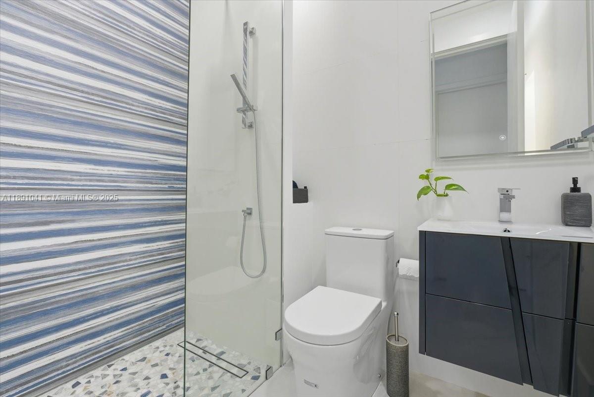 1441 154th Avenue Pembroke Pines, FL 33027 - Photo 26 of 37 a bathroom with a sink toilet and shower