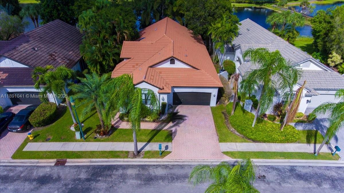 1441 154th Avenue Pembroke Pines, FL 33027 - Photo 3 of 37 a aerial view of a house