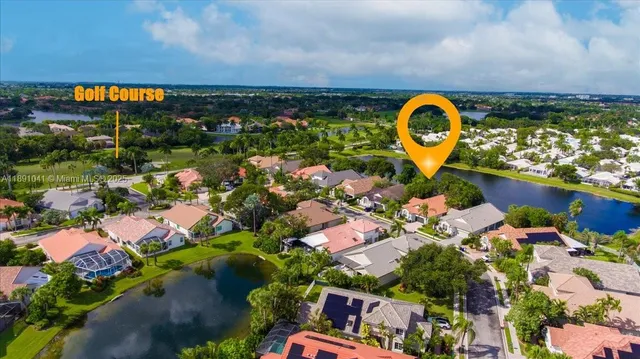 an aerial view of a house with a garden