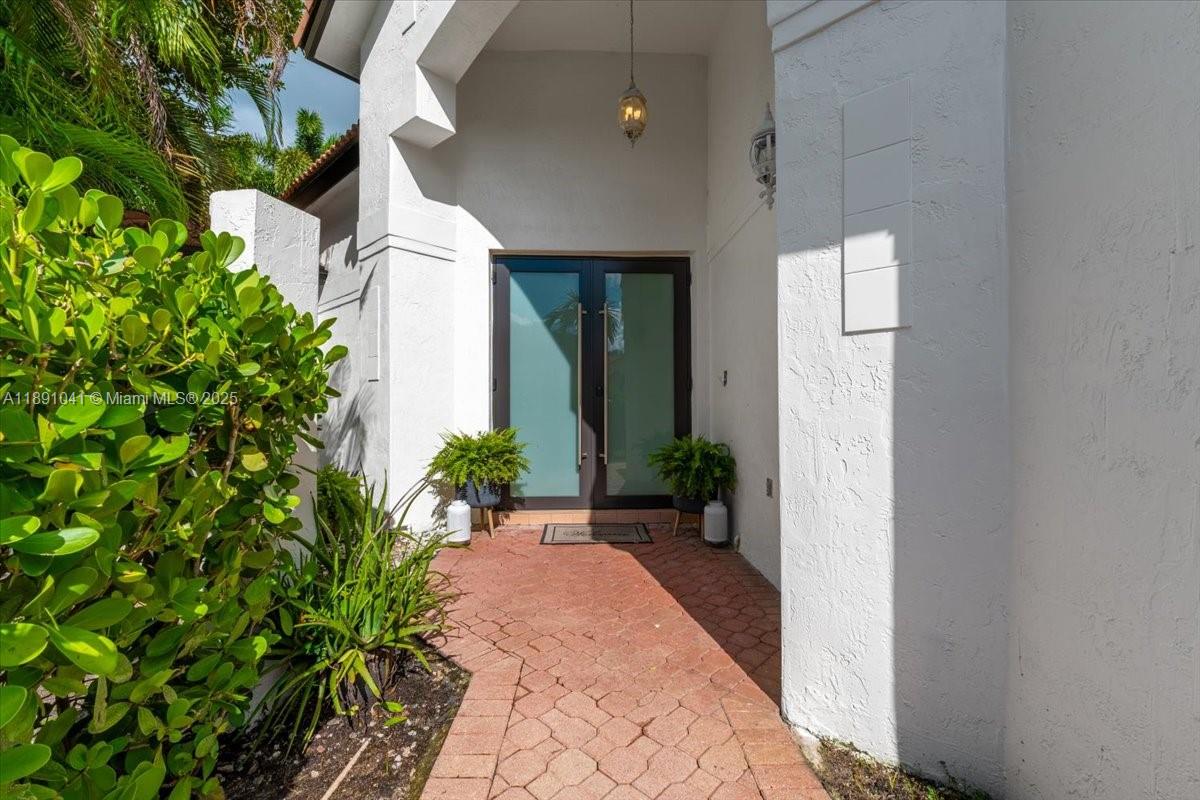 1441 154th Avenue Pembroke Pines, FL 33027 - Photo 7 of 37 a view of a pathway with a flower plants