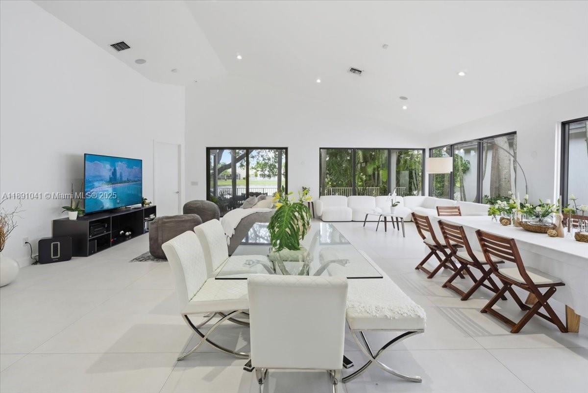 1441 154th Avenue Pembroke Pines, FL 33027 - Photo 10 of 37 a living room with fireplace furniture and a large window