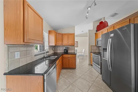 a bed room with a bed and a lamp