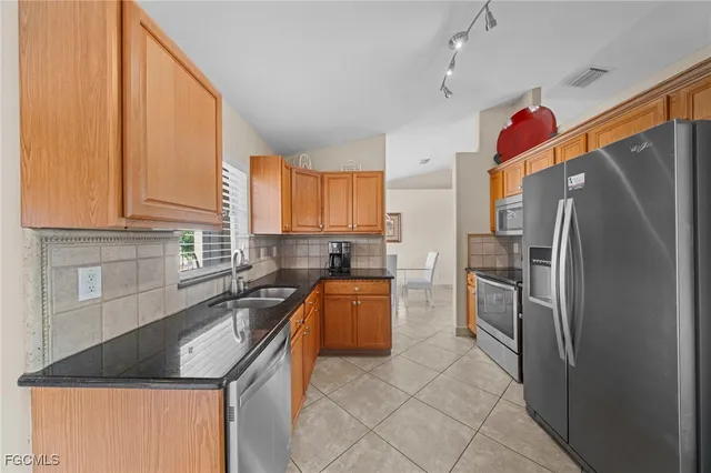 a bed room with a bed and a lamp