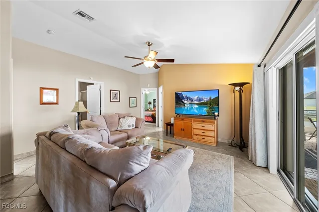 a living room with furniture window and a lamp