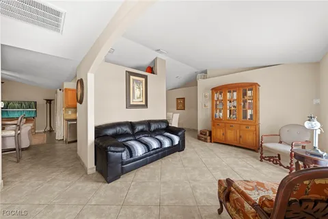a kitchen with a sink a counter top space and cabinets