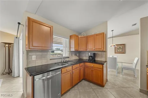 a dining room with furniture and a window