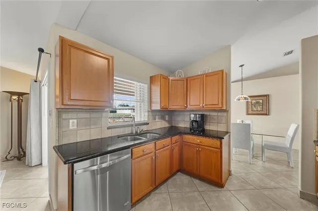 a dining room with furniture and a window
