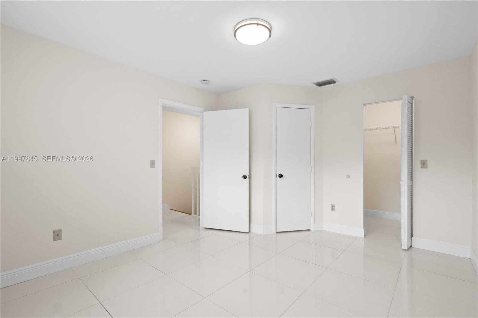 6211 Southwest 138th Court, Unit B Miami, FL 33183 - Photo 18 of 27 a view of an empty room